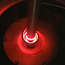 Arcast Gas Atomizer melting a titanium rod in the atomizing process