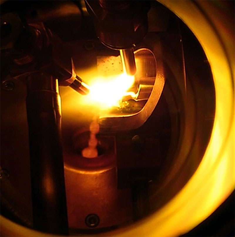 Dual plasma/arc tube feed inert gas atomizer